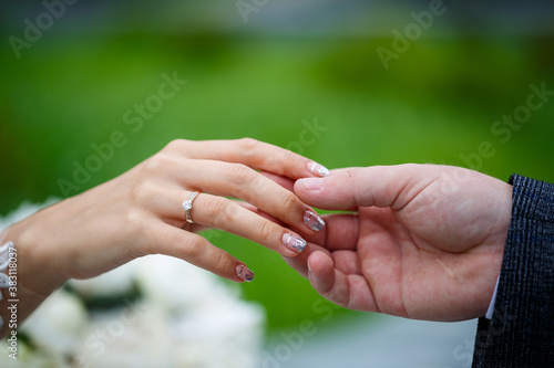 Gentle female hands of the bride with a gold wedding ring on the ring finger © Дмитрий Ткачук