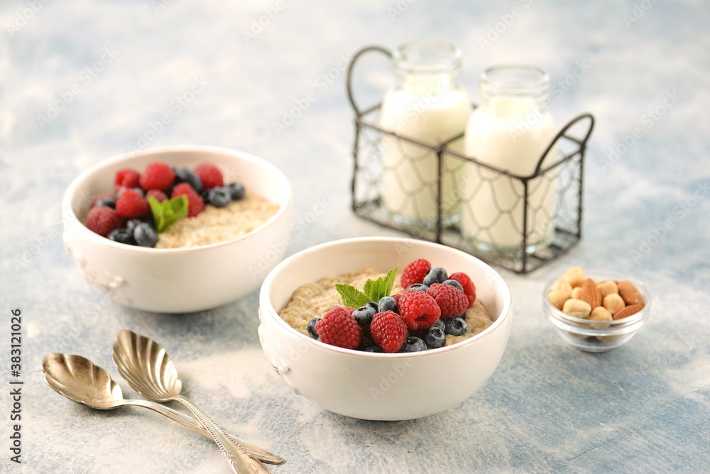 Oatmeal with fresh blueberries and raspberries. Healthy breakfast. Oatmeal with fresh blueberries and raspberries. Healthy breakfast.