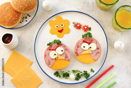 Obraz na płótnie Sandwiches with hum and cheese. Funny food for kids'.