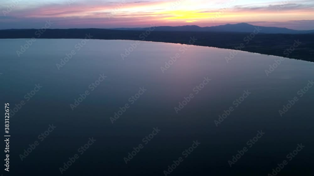 Aerial view of Lake Bolsena at sunset, a spectacular scenery. Water sky and nature Aerial view of Lake Bolsena at sunset, a spectacular scenery. Water sky and nature