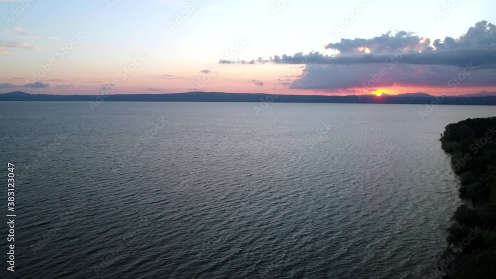 Aerial view of Lake Bolsena at sunset, a spectacular scenery. Water sky and nature Aerial view of Lake Bolsena at sunset, a spectacular scenery. Water sky and nature