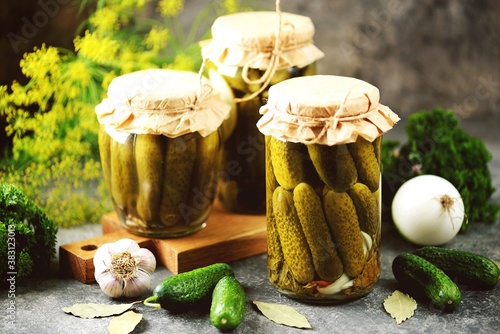 Homemade pickled cucumbers with dill, bay leaves, onions and garlic.