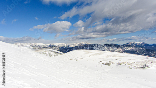 Sunny and snowy winter day in the spanish Pyrenees mountains. Landscape with snow and blue sky. © OlgaPS