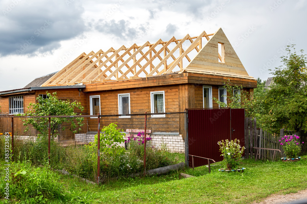 Construction new roof of a wooden house Construction new roof of a wooden house