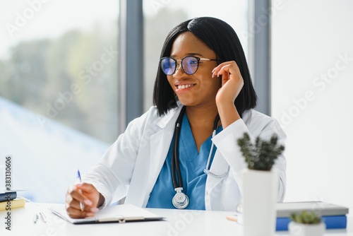 Slika na platnu Portrait of African American woman doctor smiling in hospital