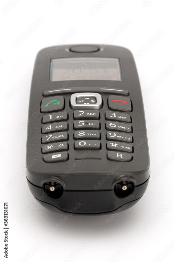 Close up of a wireless telephone with buttons 0 to 9, isolated on white background, portrait format Close up of a wireless telephone with buttons 0 to 9, isolated on white background, portrait format