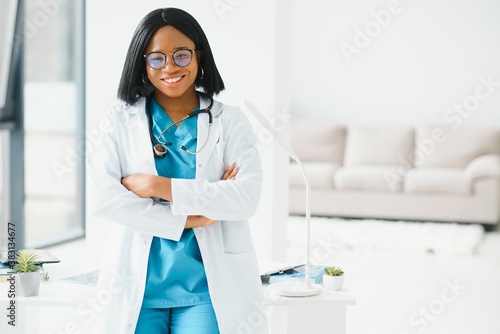 beautiful african american female pediatric nurse in modern office