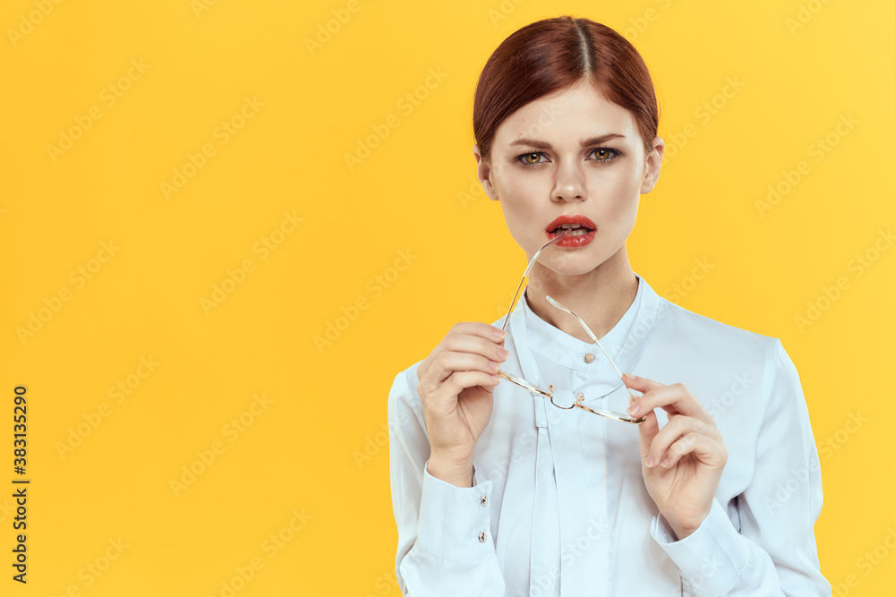 woman in white shirt wearing glasses red lips elegant style yellow isolated background woman in white shirt wearing glasses red lips elegant style yellow isolated background