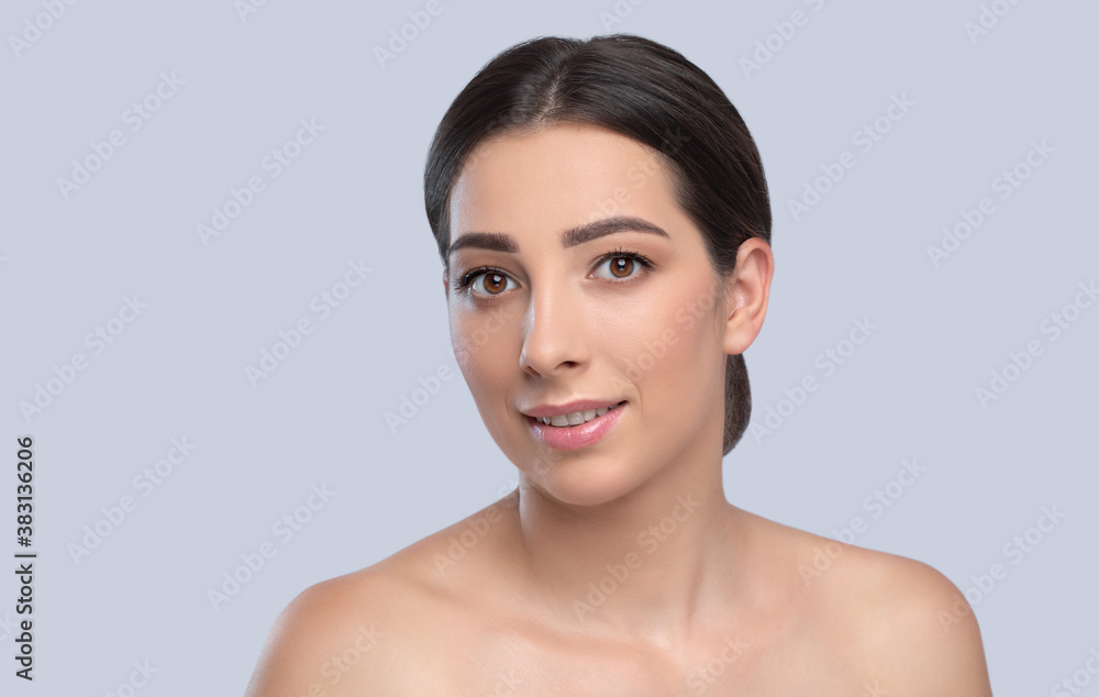 Portrait of a beautiful charming brunette woman with healthy clean skin and fresh make-up. Looking into the camera. Aesthetic cosmetology and makeup concept. Portrait of a beautiful charming brunette woman with healthy clean skin and fresh make-up. Looking into the camera. Aesthetic cosmetology and makeup concept.