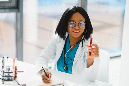 African American doctor working in her office at clinic