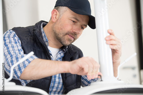 furniture repairman working on repairing the chair © auremar