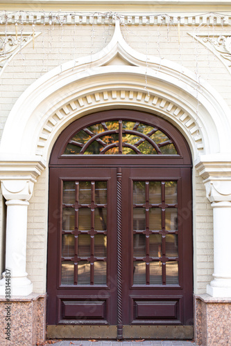 Stylish retro entrance double-leaf door arch close up