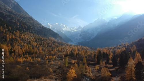 Flight over autumn landscape with view of a glacier