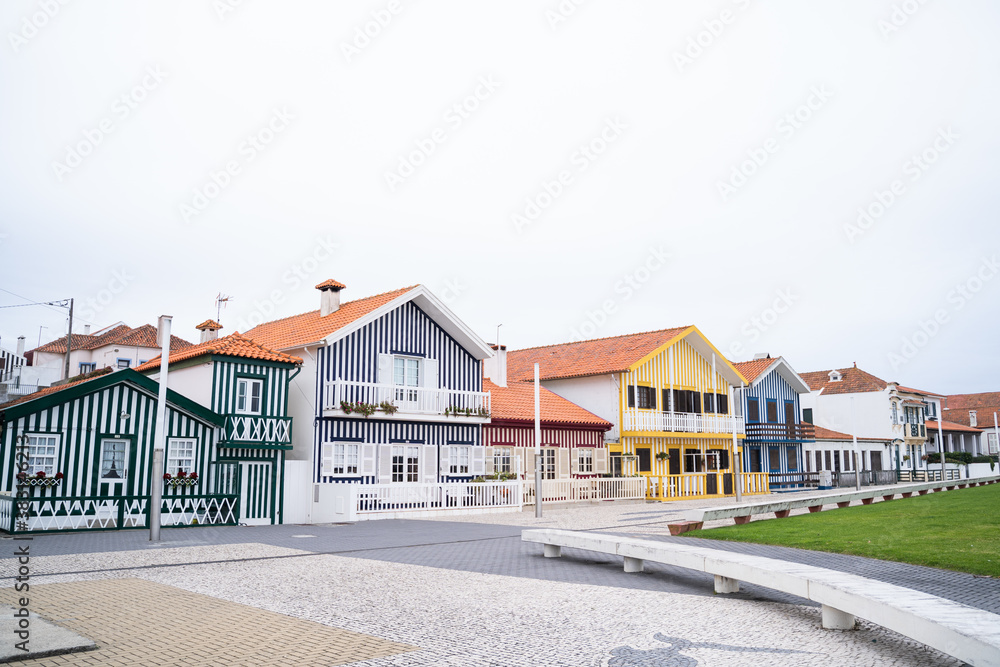 Colorful striped houses on the beach of Costa Nova. Original design in a fisherman's village. Aveiro, Portugal. Colorful striped houses on the beach of Costa Nova. Original design in a fisherman's village. Aveiro, Portugal.