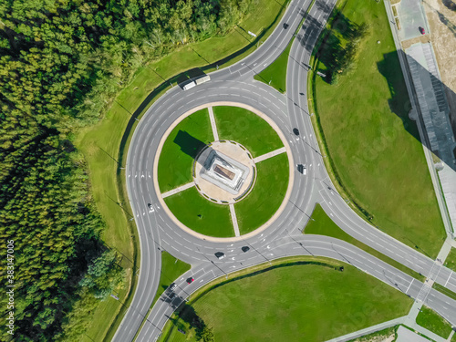 Aerial view of the ring road with a three-way fork on a Sunny summer day. City infrastructure. Beautiful top view of the ring road. © yaroslav1986