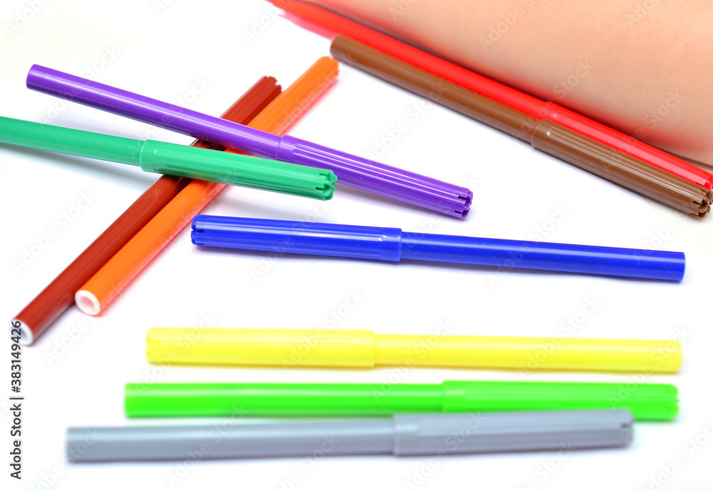 flamasters of different colors on a white background with a place for text close-up. flamasters of different colors on a white background with a place for text close-up.
