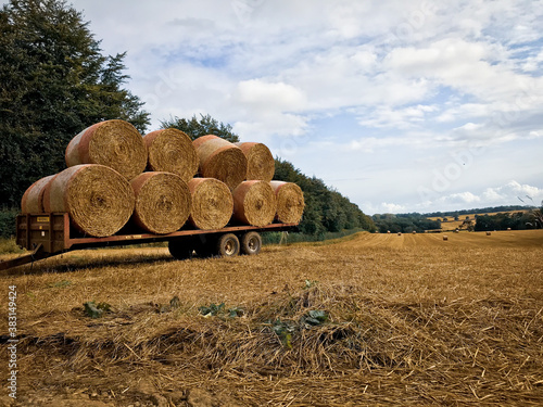 York, Northern Yorkshire - September 5 2020: A field with straw bales after harvest with clouds in the countryside
