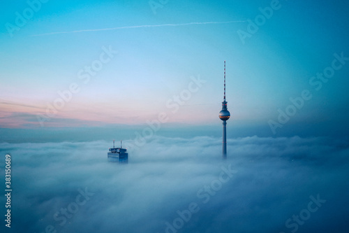 Scenic view of Fernsehturm Berlin tower against sky in morning photo