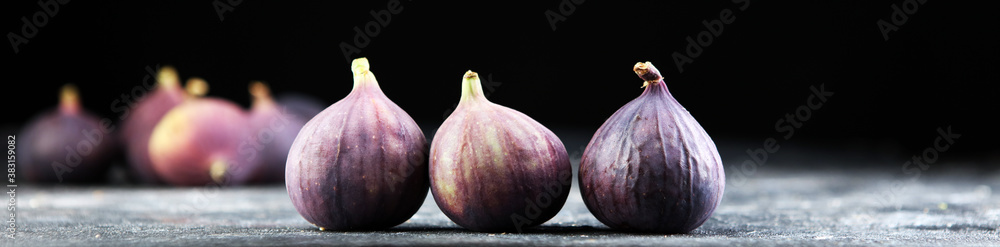 Fresh figs. Food Photo. whole and sliced figs on rustic background. Fresh figs. Food Photo. whole and sliced figs on rustic background.