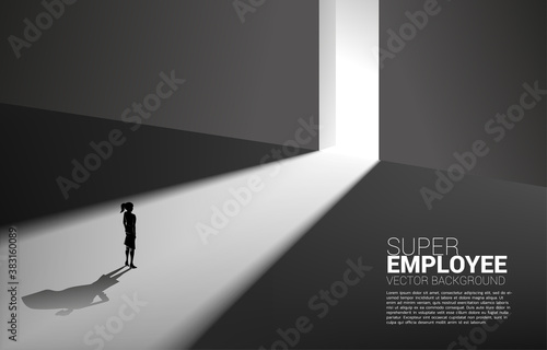 Silhouette of businesswoman and his shadow of superhero from light of exit way.concept of empower potential and human resource management