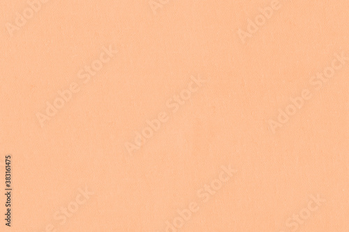 Vintage and old looking paper background. Colored orange with a brown retro book cover. Ancient book page.