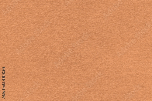 Vintage and old looking paper background. Colored orange with a brown retro book cover. Ancient book page.