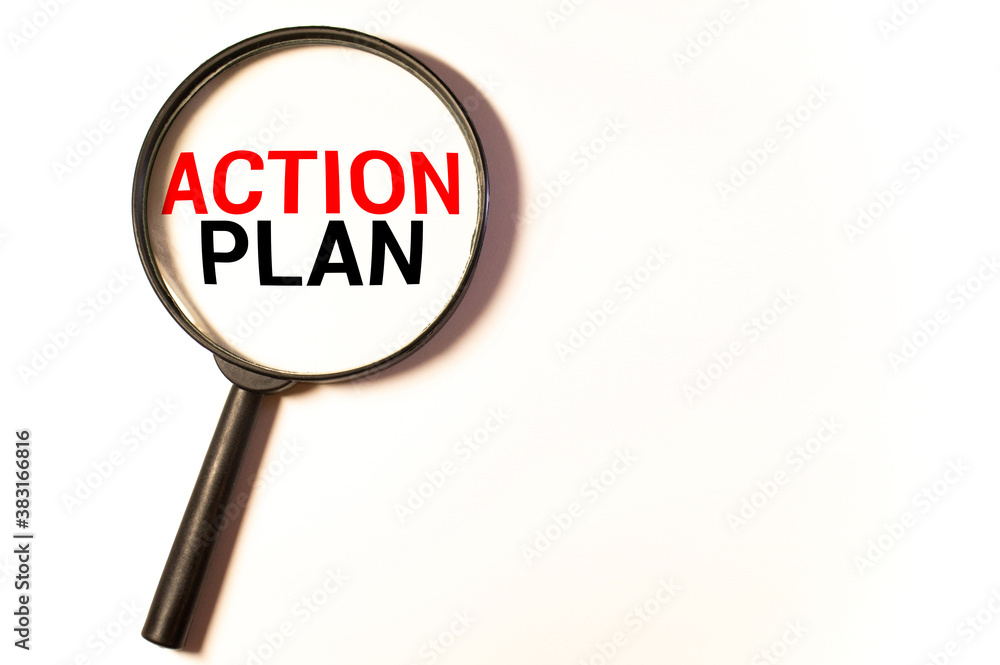 Hand holding magnifying glass with words action plan concept. Hand holding magnifying glass with words action plan concept.
