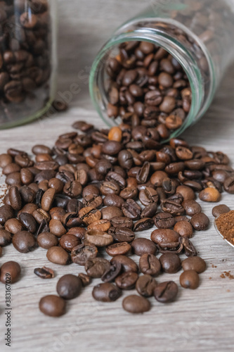 a cup on the table with coffee beans