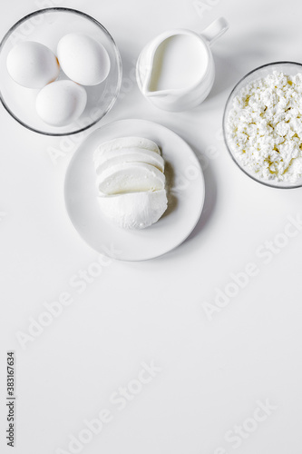 Healthy food concept with milk on white table top view mock-up