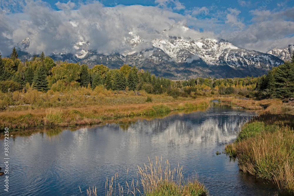 Water reflections in the Grand Tetons in summer.