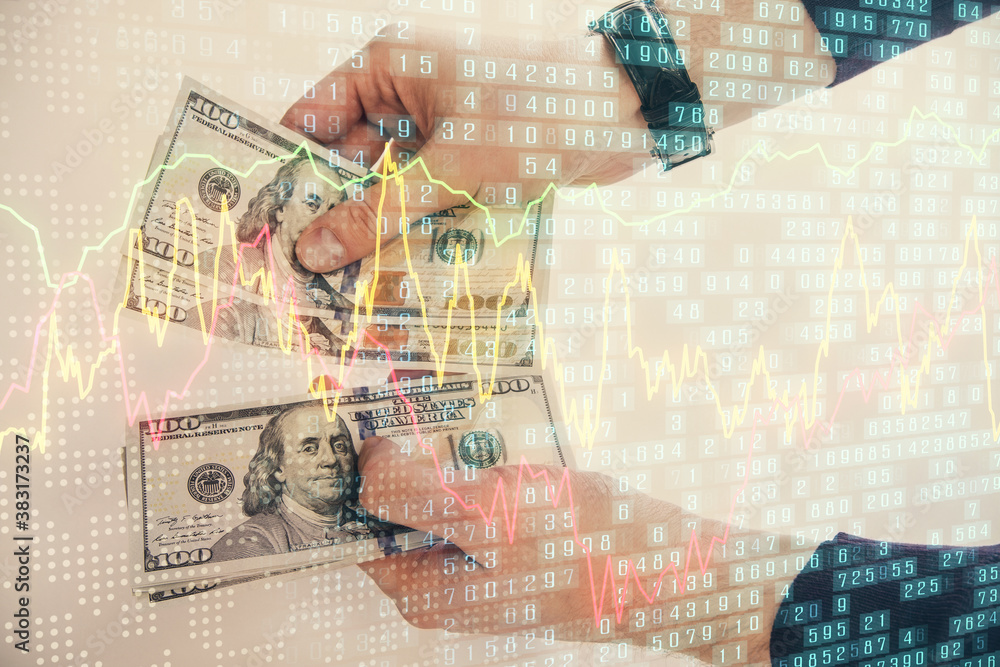 Multi exposure of financial graph drawing hologram and USA dollars bills and man hands. Analysis concept. Multi exposure of financial graph drawing hologram and USA dollars bills and man hands. Analysis concept.