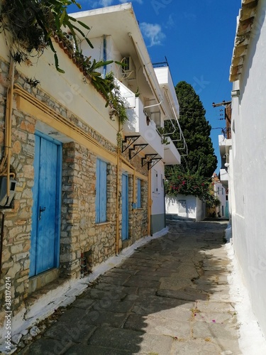 blue and white houses and doors in greece. Greek Ermioni road or street.