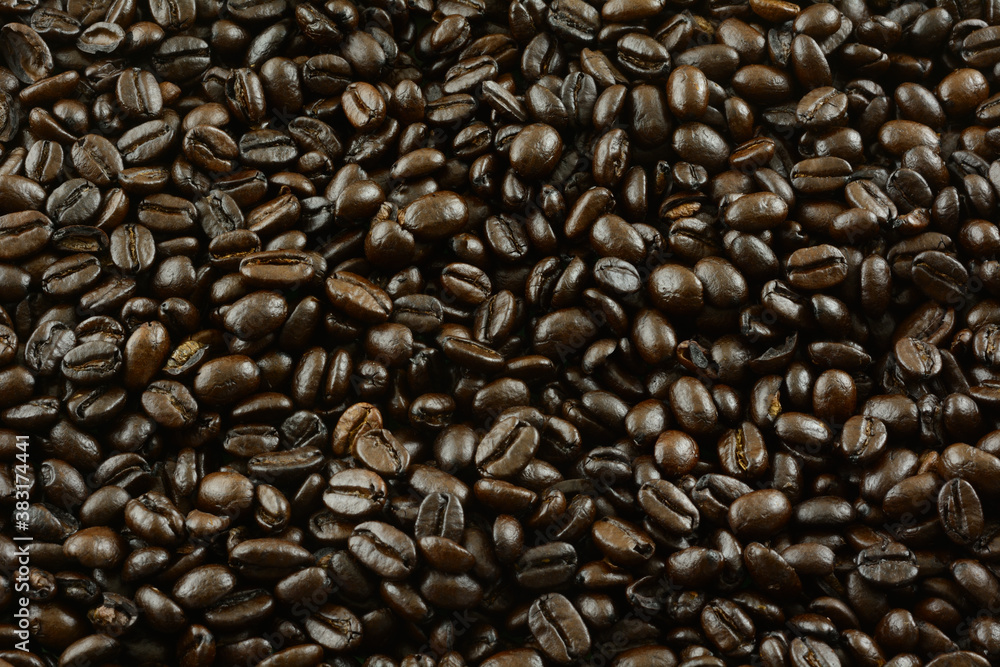 Food background of closeup of extra dark French whole bean coffee Food background of closeup of extra dark French whole bean coffee
