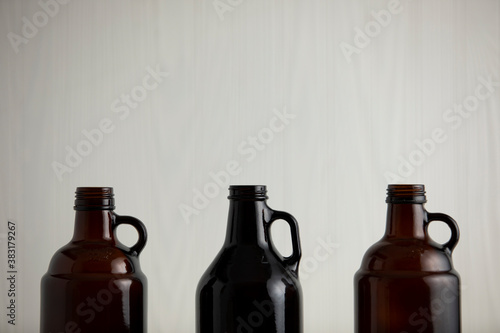 beer growler bottles for craft beer with white space for a copy over a white background