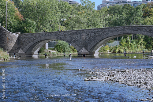 Photography Wading in a river for fall salmon fishing, Humber River, Toronto
