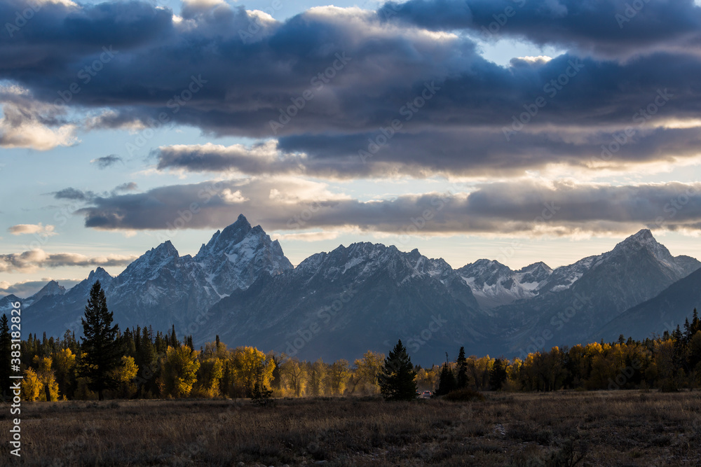 Landscape view of the Grand Teton mountain range during sunset in Grand Teton National Park (Wyoming). Landscape view of the Grand Teton mountain range during sunset in Grand Teton National Park (Wyoming).