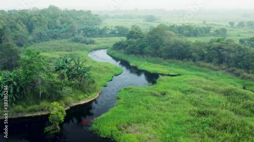 Aerial drone view of a river in the rainforest of Borneo (Kalimantan) in Indonesia. photo