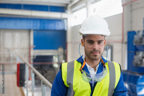 Fényképezés Portrait confident male worker in protective workwear in factory