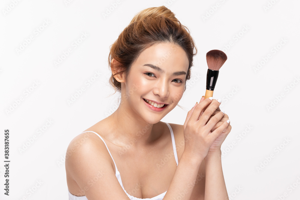 Beautiful Asian young woman smile and holding make up brush with healthy Clean and Fresh skin feeling so happiness and cheerful,Isolated on white background,Beauty Cosmetics Concept Beautiful Asian young woman smile and holding make up brush with healthy Clean and Fresh skin feeling so happiness and cheerful,Isolated on white background,Beauty Cosmetics Concept