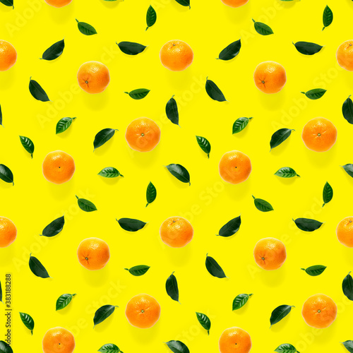 Fototapeta Naklejka Na Ścianę i Meble -  Mandarine seamless pattern, tangerine, clementine isolated on yellow background with green leaves. Collection of fine seamless patterns.