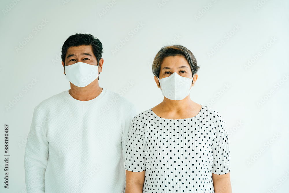 Senior couple in white shirt wear mask isolate on background.