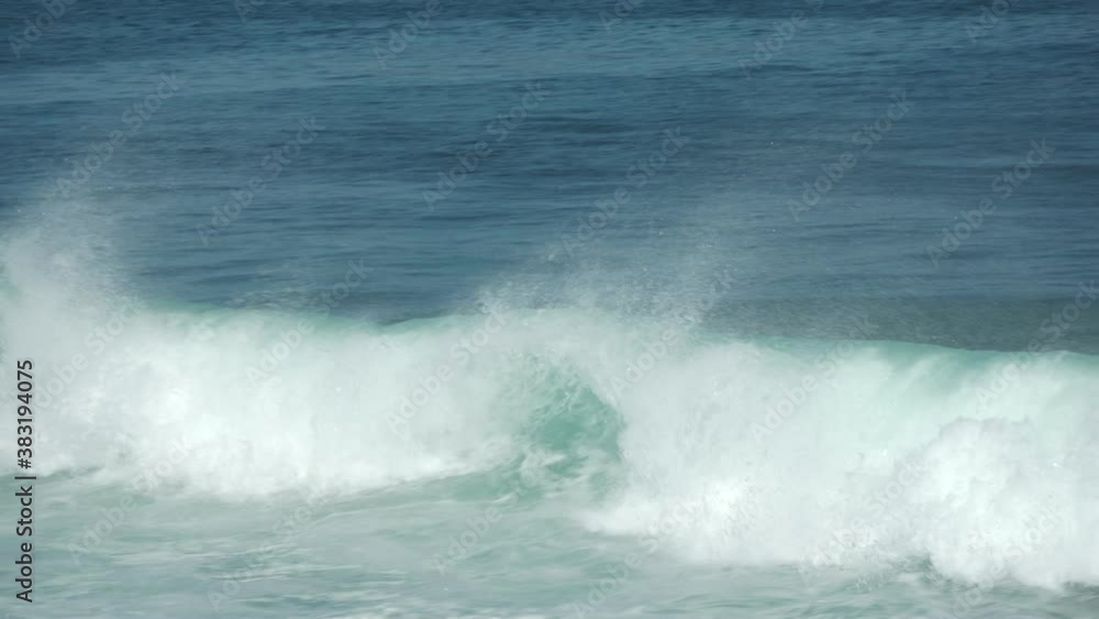 Rolling Turquoise Waves with Whitecaps Crashing into Rocky Shore with Sally Lightfoot Crabs in the Galapagos Islands Rolling Turquoise Waves with Whitecaps Crashing into Rocky Shore with Sally Lightfoot Crabs in the Galapagos Islands