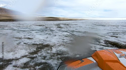 Rough and bumpy ride on 4x4 buggy car on the frozen land of glacier from go pro mounted with drops on the camera.
