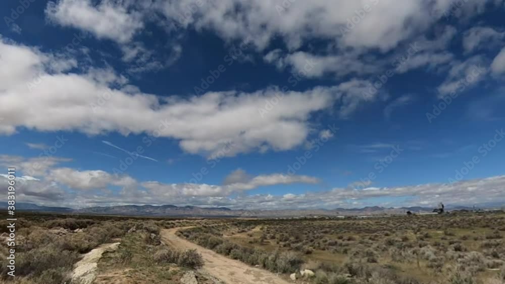 Clouds rolling in over the Mojave Desert landscape - low angle panoramic time lapse Clouds rolling in over the Mojave Desert landscape - low angle panoramic time lapse