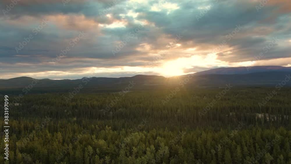 View of Scenic Valley surrounded by Mountains at Sunset in Canadian Nature. Aerial Drone Shot. Yukon, Canada. 4K View of Scenic Valley surrounded by Mountains at Sunset in Canadian Nature. Aerial Drone Shot. Yukon, Canada. 4K