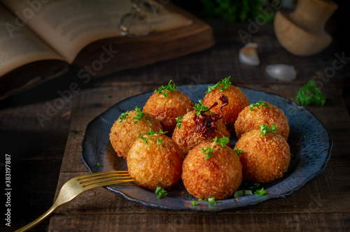 Traditional Italian arancini (rice balls with Mozzarella cheese) 