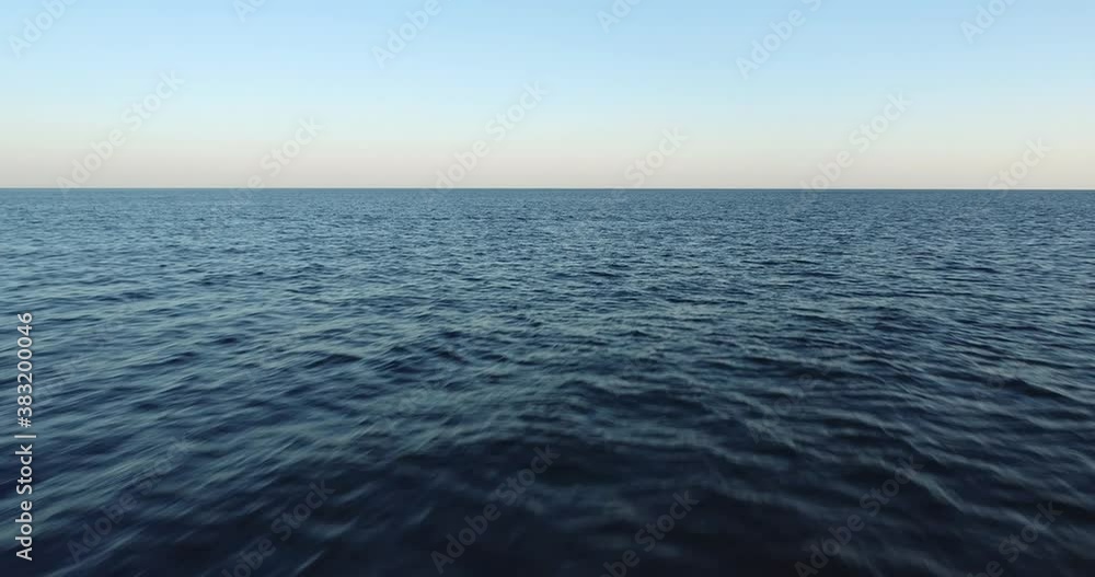 Calm sea horison background texture with small wave and clear sky / aerial fast speed drone shot at summer morning view Calm sea horison background texture with small wave and clear sky / aerial fast speed drone shot at summer morning view