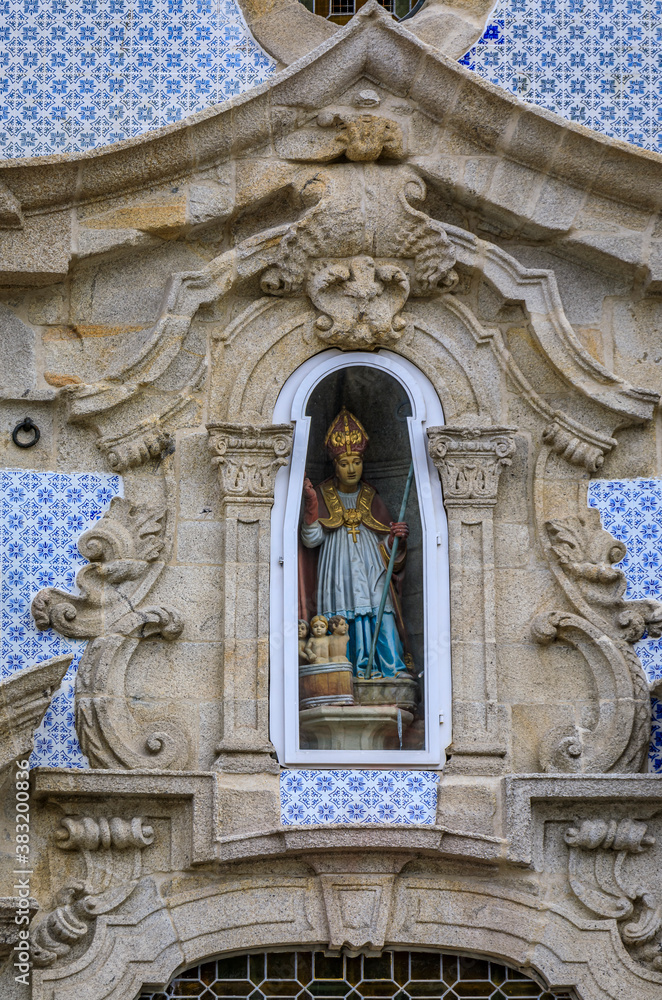 Details of facade statue of Saint Nicholas at Parish Church of St. Nicholas or Igreja de Sao Nicolau in Porto, Portugal