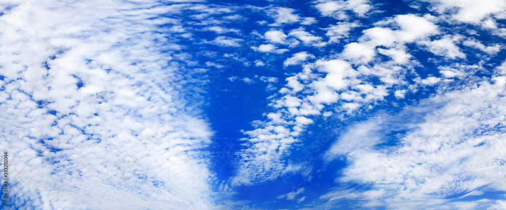 White cirrus clouds blue sky background, beautiful wispy cloudscape wide panoramic view, cumulus cloudy skies panorama, fluffy cloud texture, sunny heaven scenic landscape, cloudiness weather backdrop