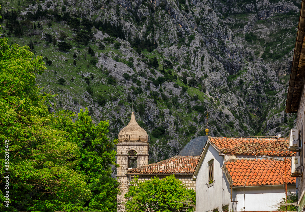 View onto Saint Nicholas or Nikole church over the red terracotta tile rooftops of the Old Town of Kotor, Montenegro